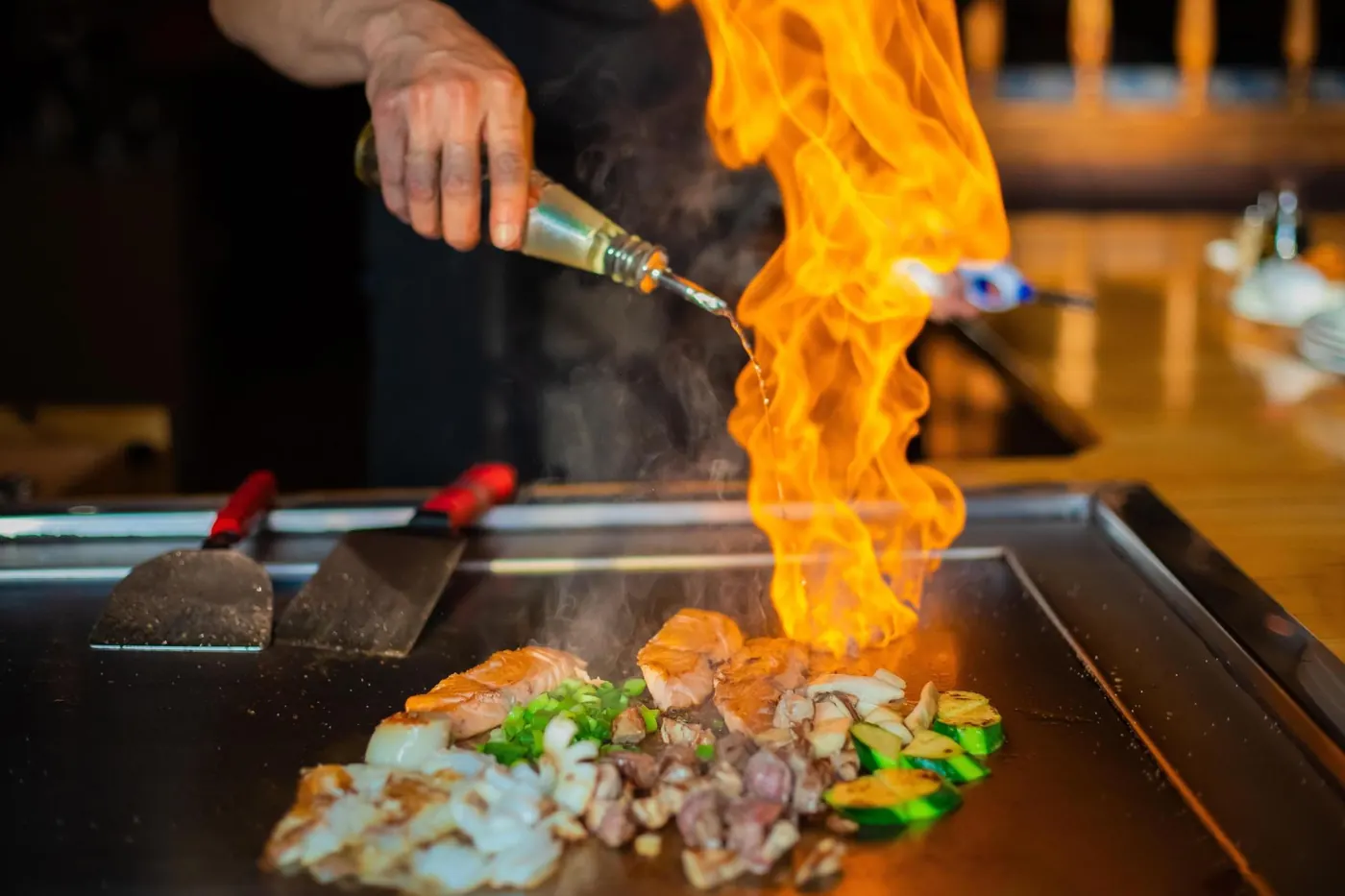 Chef flambé on the grill Chef flambé on the grill – hibachi at home party photo