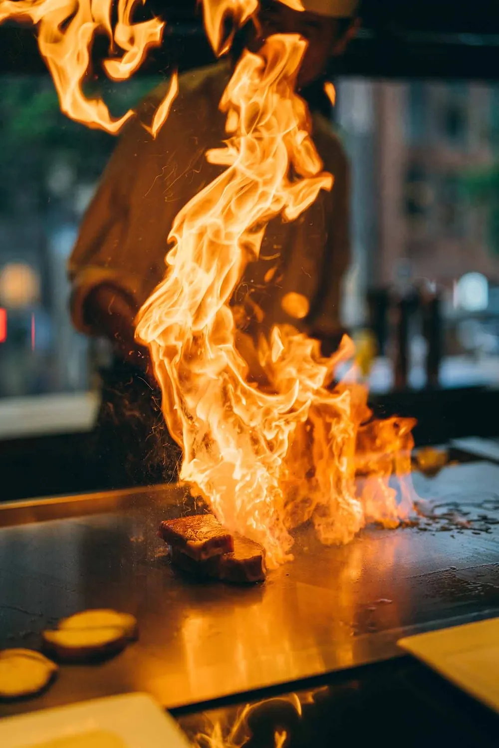 Tall flame from the teppanyaki grill Tall flame from the teppanyaki grill – hibachi at home party photo
